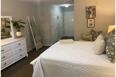 Well-decorated private resident room with comfortable furnishings