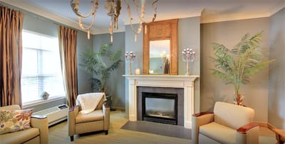 Cozy common area with seating and a fireplace