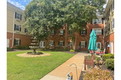 Peaceful outdoor area with benches and fountain