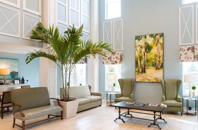 Bright lobby area with comfortable seating and art