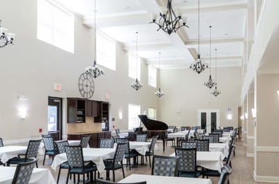 Dining room with tables set for residents
