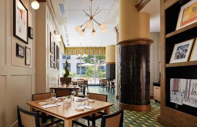 Bright dining room with elegant decor and table settings