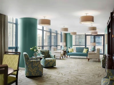 Bright common area with comfortable seating and large windows