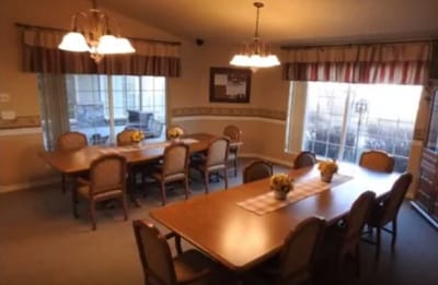 Bright dining room with large windows and tables