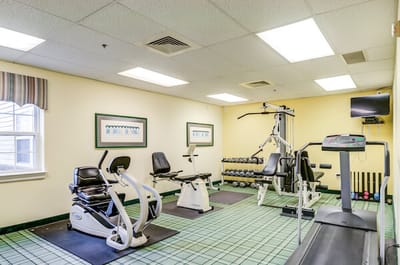 Well-equipped fitness room with exercise machines