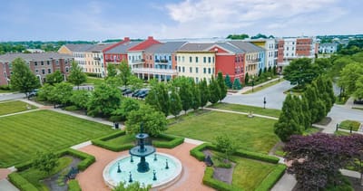 Aerial view of a senior living facility with gardens