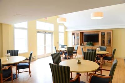 Bright common area with tables and chairs