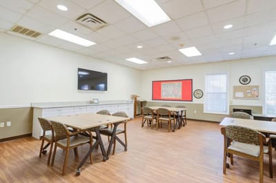 Interior view of a common area with tables and chairs
