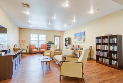 Common area with seating and bookshelves