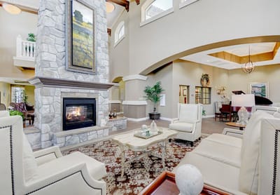 Bright common area with seating and fireplace
