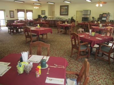 Dining room setup with tables and chairs
