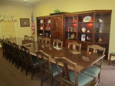 Dining area with a large table and cabinets