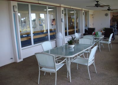 Bright common area with seating and tables