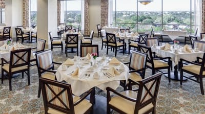 Elegant dining room setup with tables and view