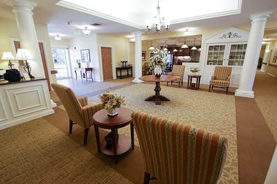 Brightly lit common area with seating and decor