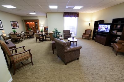 Interior common area with seating and a TV