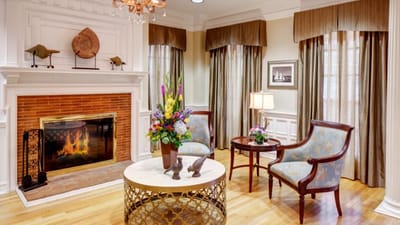 Elegant common area with a fireplace and seating