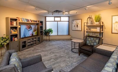 Interior common area with seating and a TV