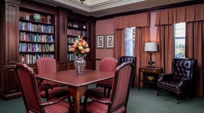 Cozy common area with bookshelves and seating