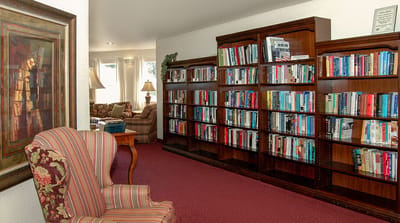 Cozy reading nook with bookshelves and comfortable seating