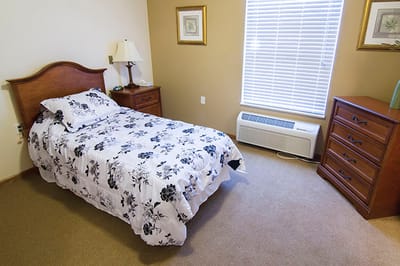 Cozy private resident room with floral bedding