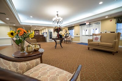 Bright common area with seating and flowers