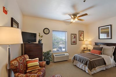Cozy private room with a bed and seating area