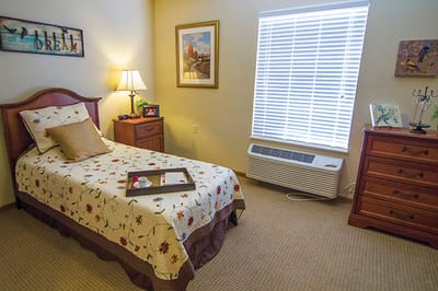 Cozy resident room with bed and decor