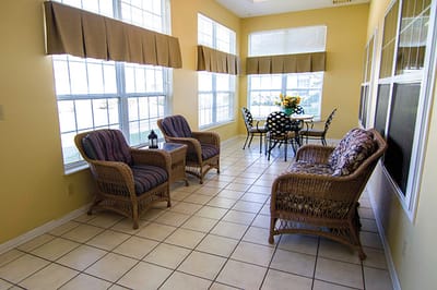 Bright common area with seating and large windows