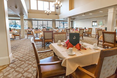 Elegant dining room setup with tables and chairs