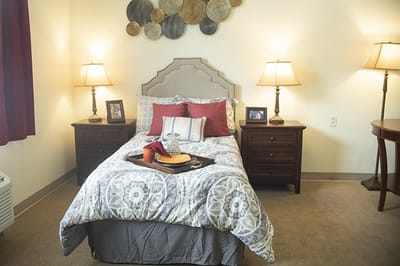 Cozy private resident room with bedding and decor