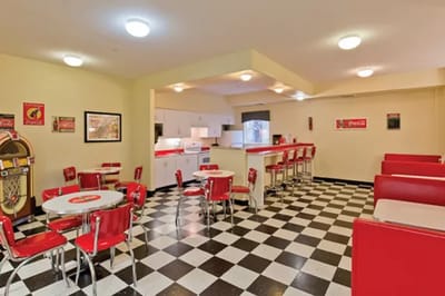 Interior view of a retro-themed dining area with red seating
