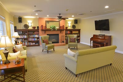 Bright common area with seating and bookshelves