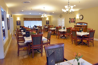 Dining area with tables and chairs ready for service