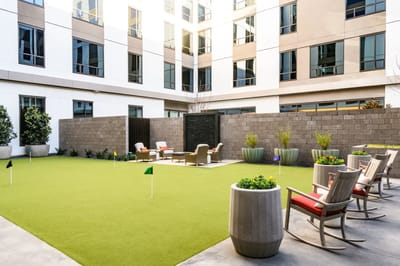 Outdoor seating area with putting green and chairs