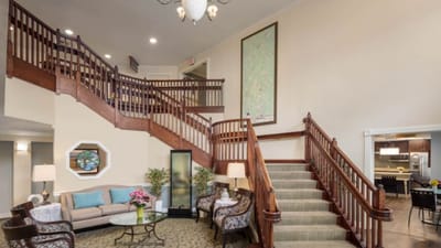 Welcoming lobby area with a staircase and seating