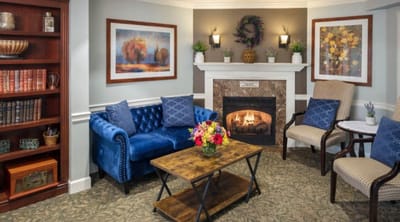 Cozy interior of a common area with fireplace and seating