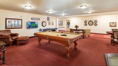 Common area with a pool table and seating