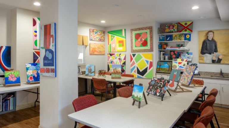 Art activity room filled with colorful paintings