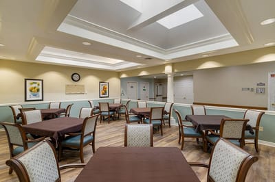 Bright dining room with tables set for meals