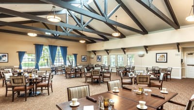 Bright dining area with tables and chairs