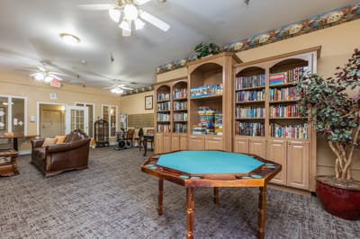 Interior view of a cozy common area with bookshelves