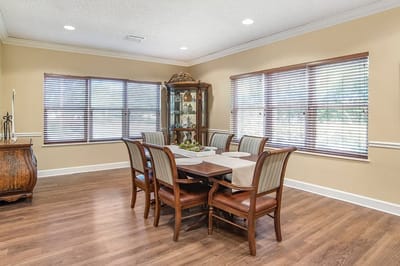 Interior dining room with wooden table and chairs