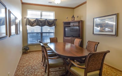 Common area with a large table and chairs