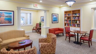 Common area with seating and bookshelves