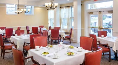 Dining area with set tables and food served