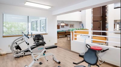 Interior view of a fitness area with exercise equipment