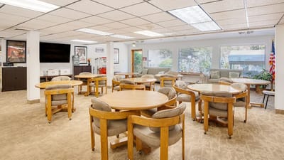Interior view of a common room with tables and chairs