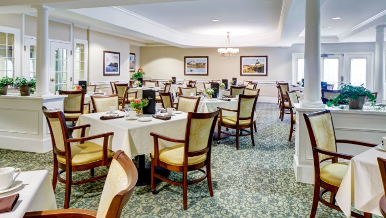 Bright dining room with tables set for meals