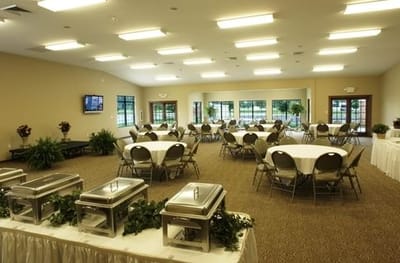 A dining area set up for an event with round tables